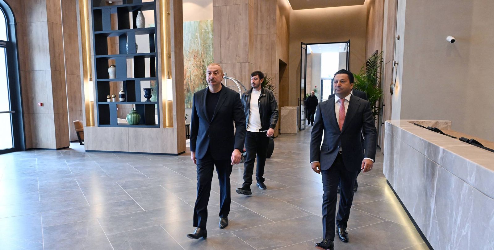 Ilham Aliyev walking through the lobby of Ağdam City Hotel on 19 September 2024